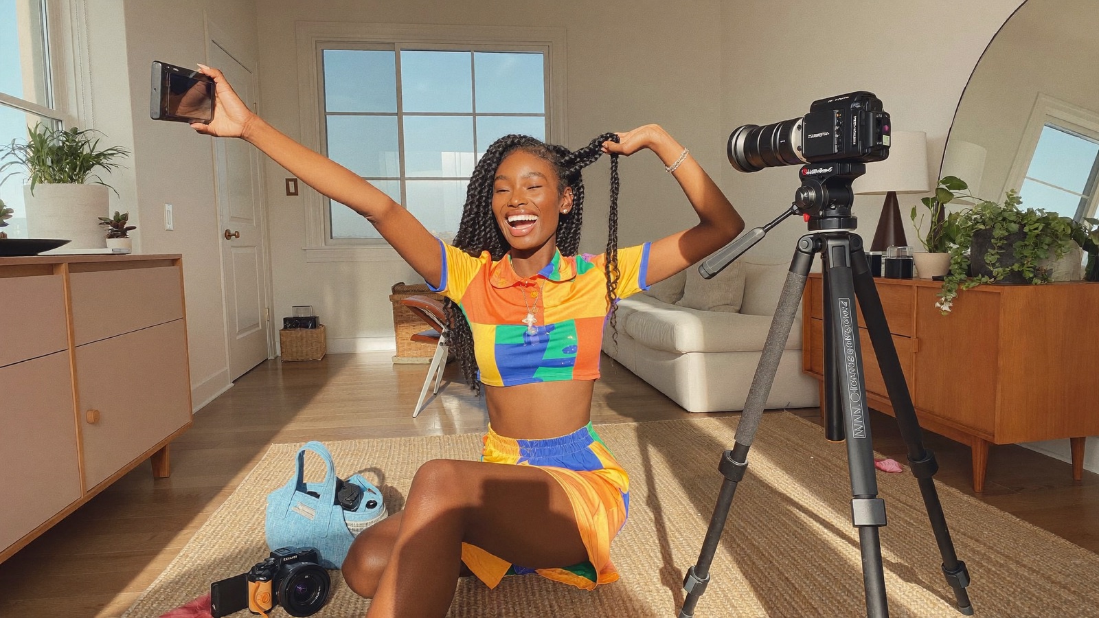 A joyful creator filming content in daylight, relaxed because creating is her only job
