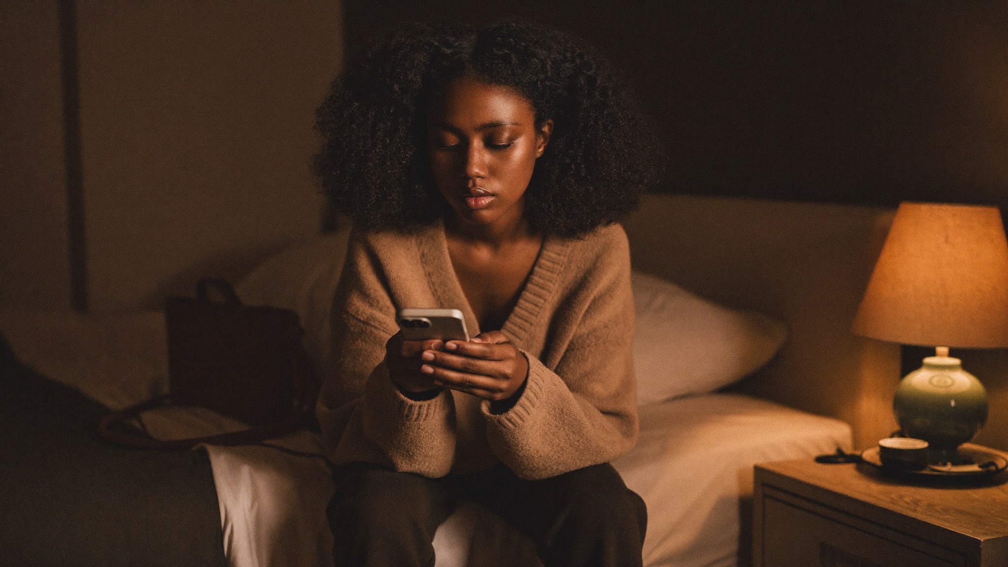 Model counting her earnings on her phone at night