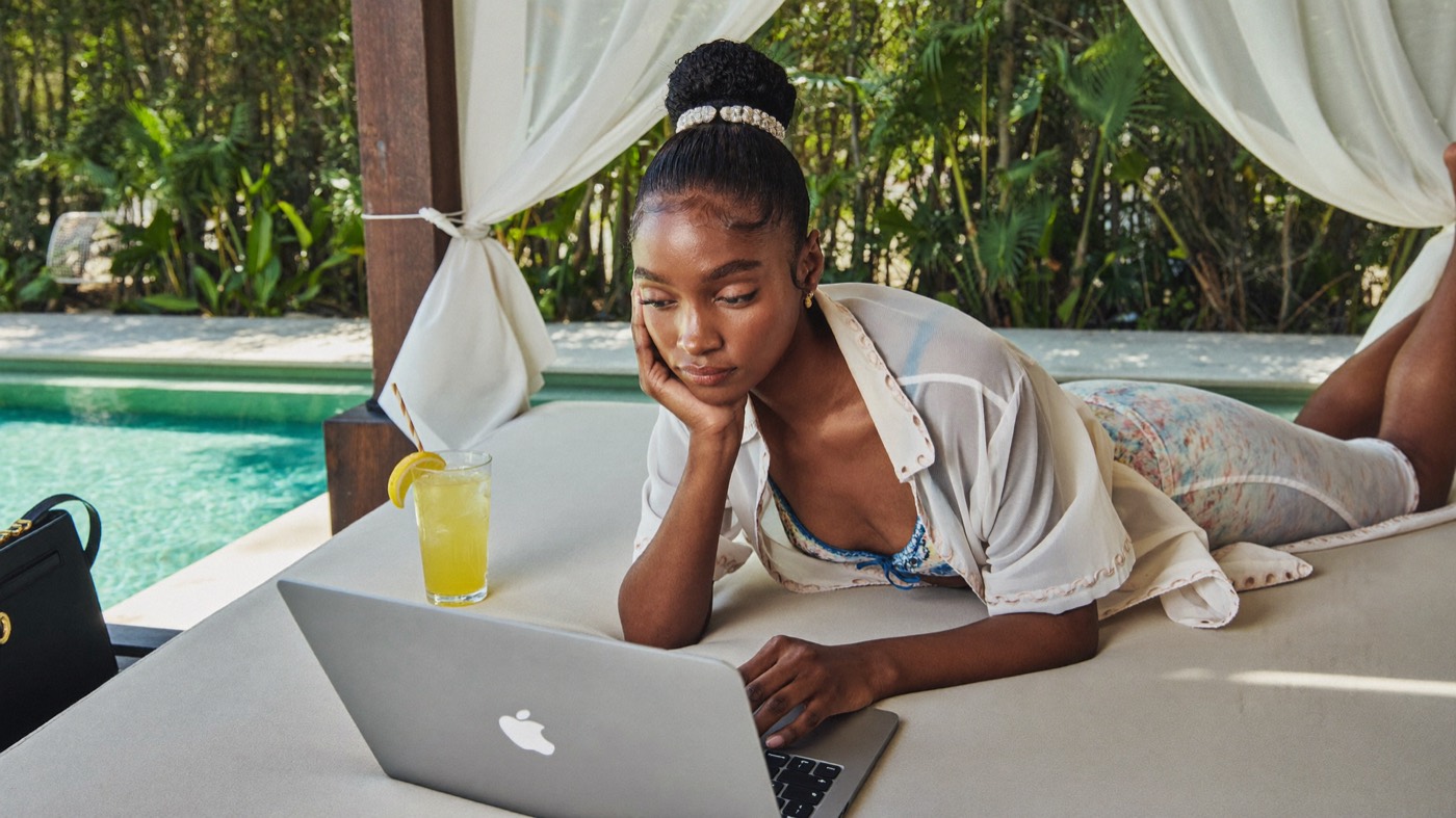 Creator doing her numbers with a laptop